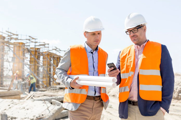 Workers checking mobile app